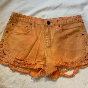 Orange free people Jean shorts with lace